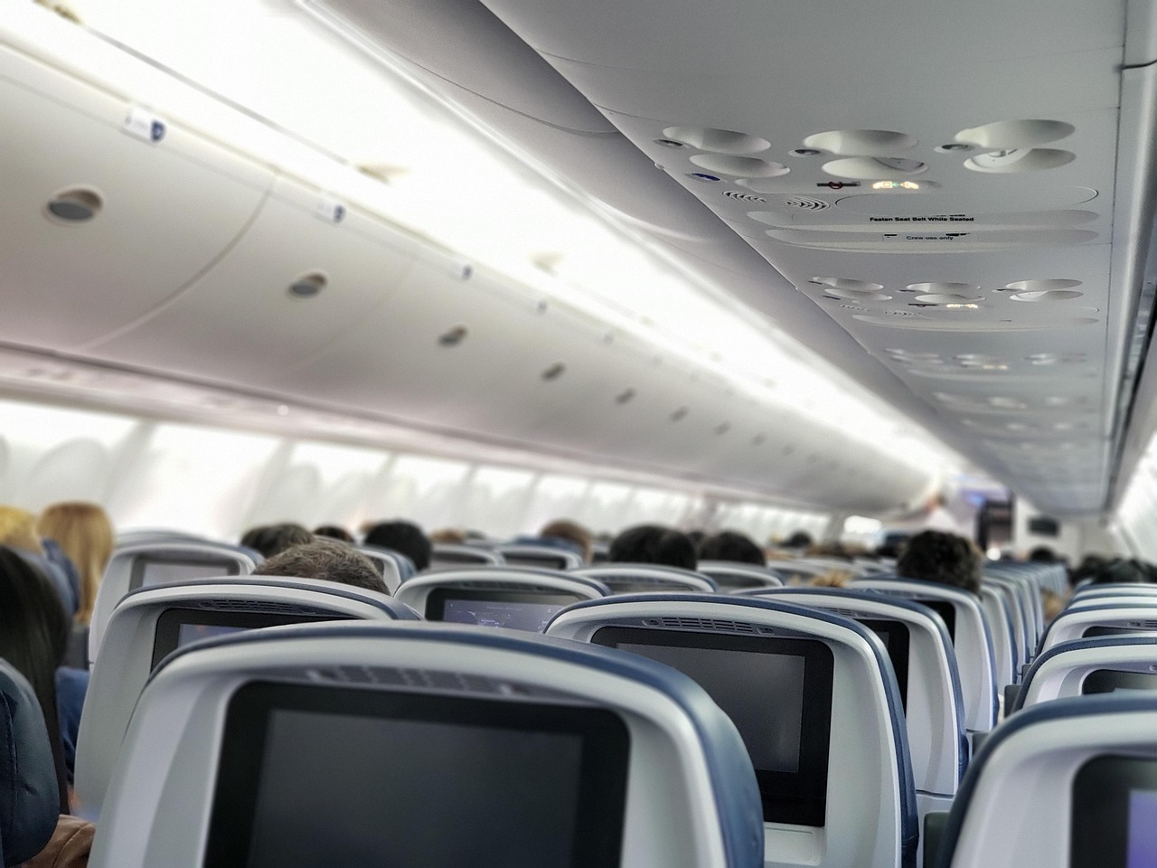 Sleeping upright on a plane without wrecking your neck